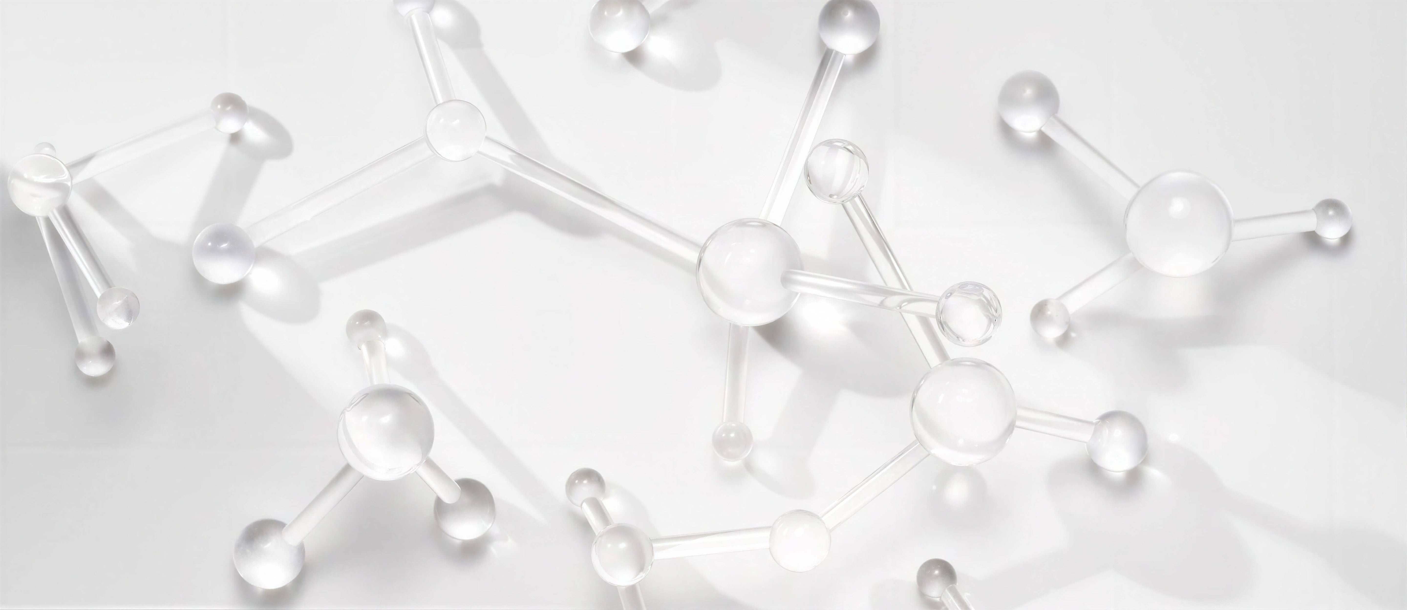 Polyhydroxisyra PHA molekyler som illustrerar mild exfoliering för känslig hud.