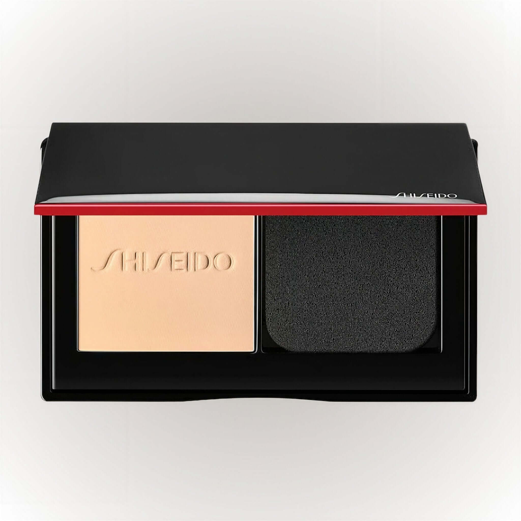 Shiseido Synchro Skin Self-Refreshing Custom Finish Powder Foundation med sminksvamp i förpackning.