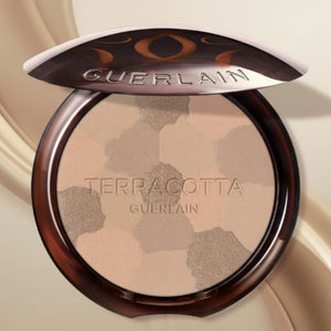 Guerlain bronzerpuder i kompakt ask med ljusvarma nyanser, rund pan