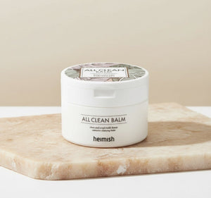 Heimish -- All Clean Balm 50ml i en vit burk på en stenplatta.