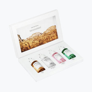SKIN1004 ampullkit i presentask, fyra små flaskor med pipett