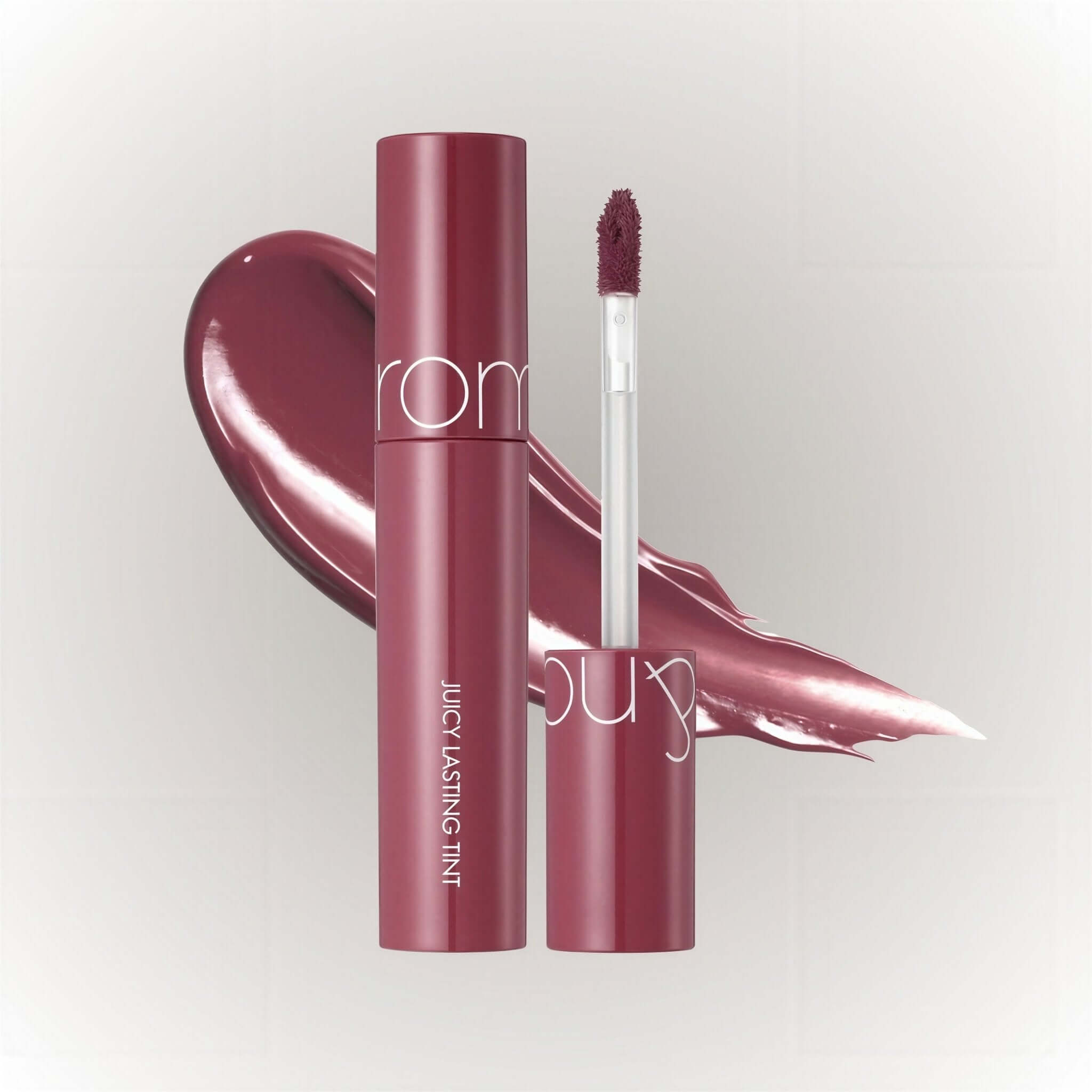 rom&nd Juicy Lasting Tint #06 Figfig med applikator och färgfläck.