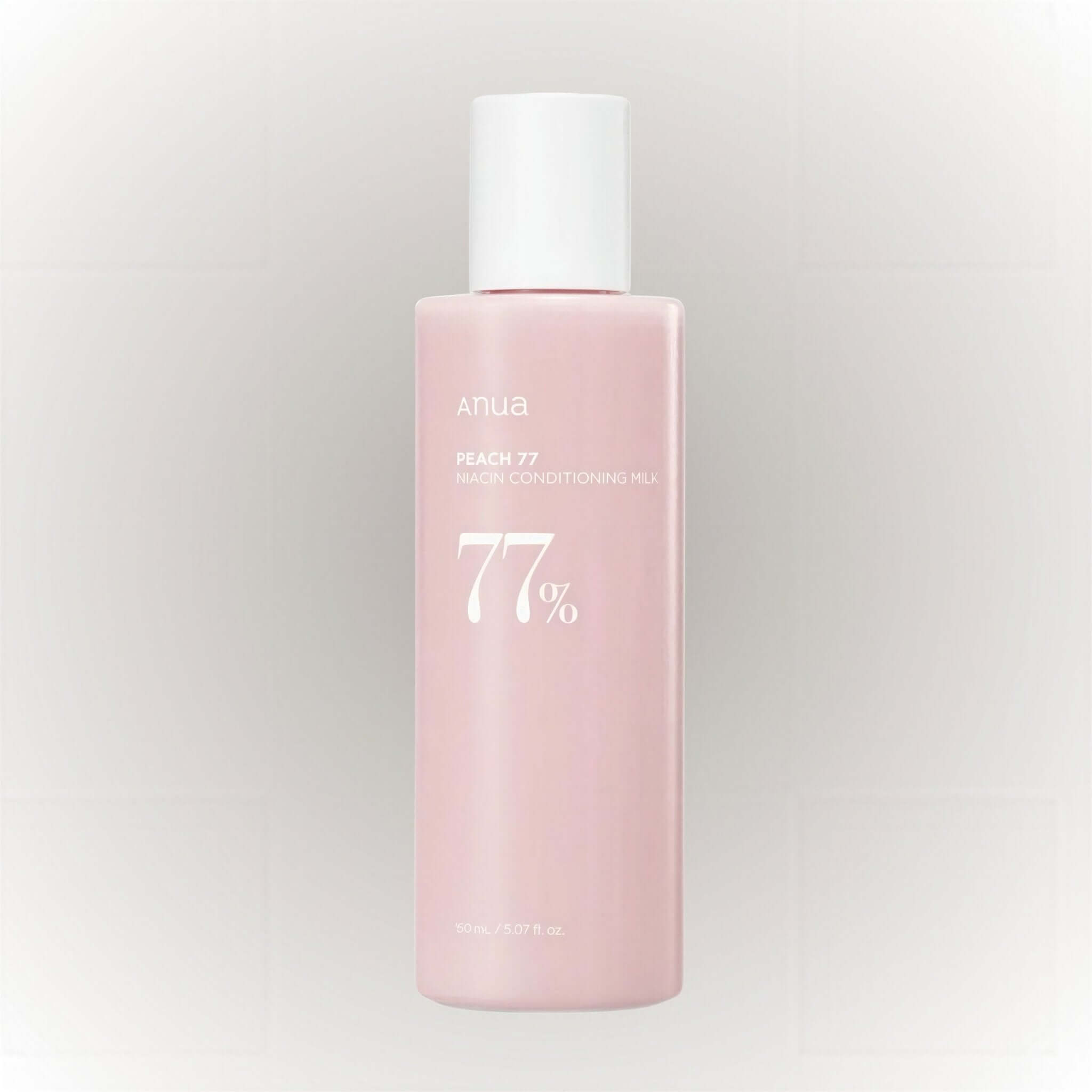 Anua Peach 77% Niacin Conditioning Milk 150ml i en rosa flaska, återfuktande och lystergivande.