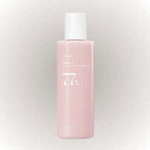 Anua Peach 77% Niacin Conditioning Milk 150ml i en rosa flaska, återfuktande och lystergivande.