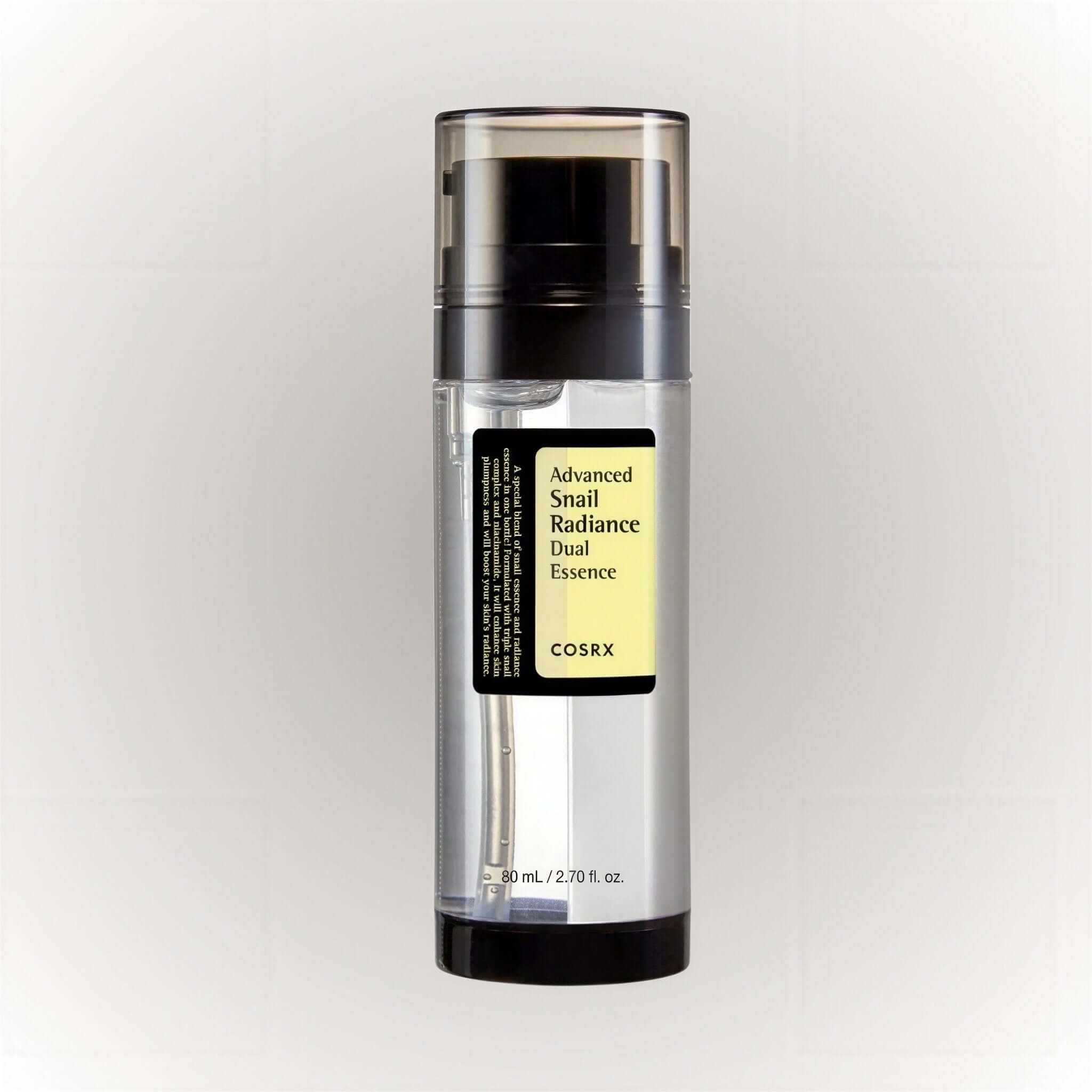 COSRX Advanced Snail Radiance Dual Essence 80ml i en elegant flaska med dubbel-pump och lätt formula.