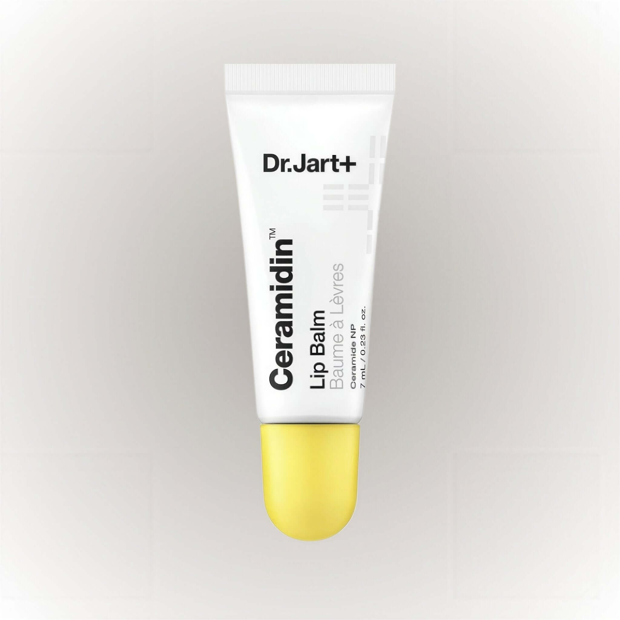 Dr.Jart+ Ceramidin Lip Balm Ceramides NP 7ml tube with a yellow cap on a light background.