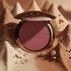 Guerlain Terracotta rougekompakt med mörkrosa puder, rund kantad dosa