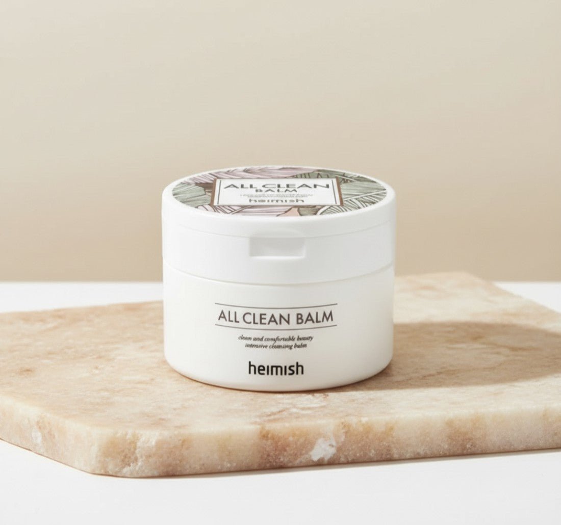 Heimish -- All Clean Balm 50ml i en vit burk på en stenplatta.