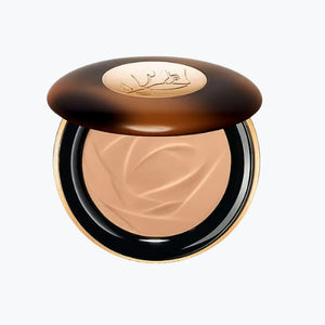 Bronzerkompakt med öppet beige puder och mörkbrunt lock