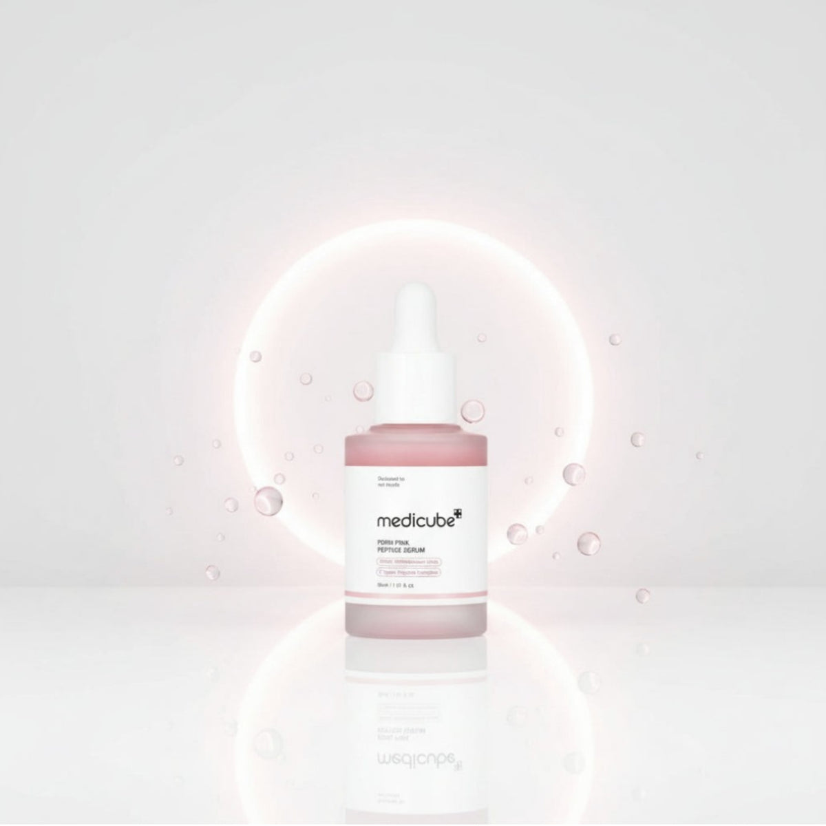 Rosa peptidserumflaska med pipettlock och droppande siluett, Medicube