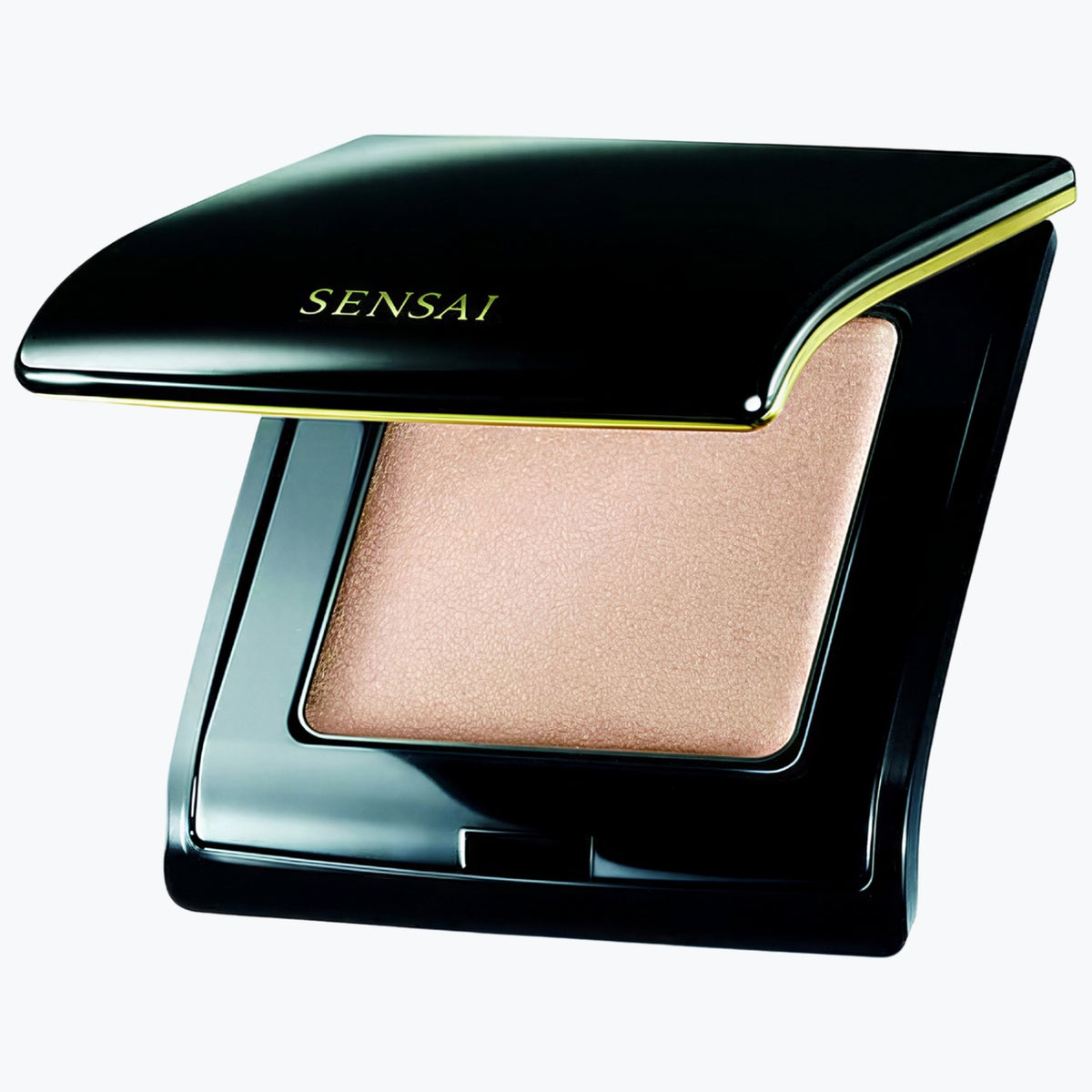 Kompakt highlighter i svart hölje med beige skimrande pudelock