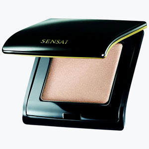 Kompakt highlighter i svart hölje med beige skimrande pudelock