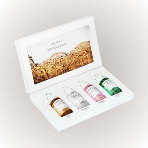 SKIN1004 Madagascar Centella Ampoule Kit Gift Box med fyra ampuller i en elegant förpackning.