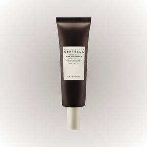 SKIN1004 Madagascar Centella Probio-Cica Glow Sun Ampoule 50ml i en mörk förpackning.