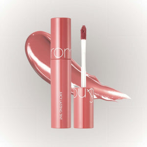 rom&nd Juicy Lasting Tint #09 Litchi Coral med spegelblank finish och applikator.